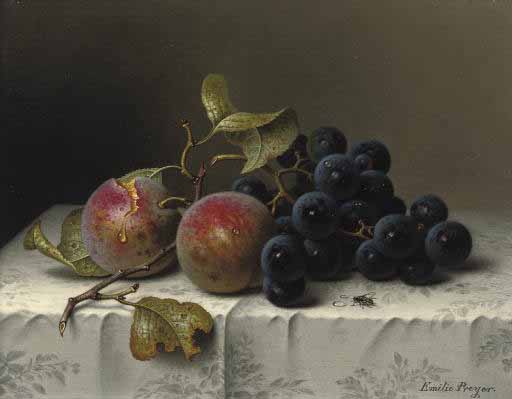 Prunes and grapes on a damast tablecloth